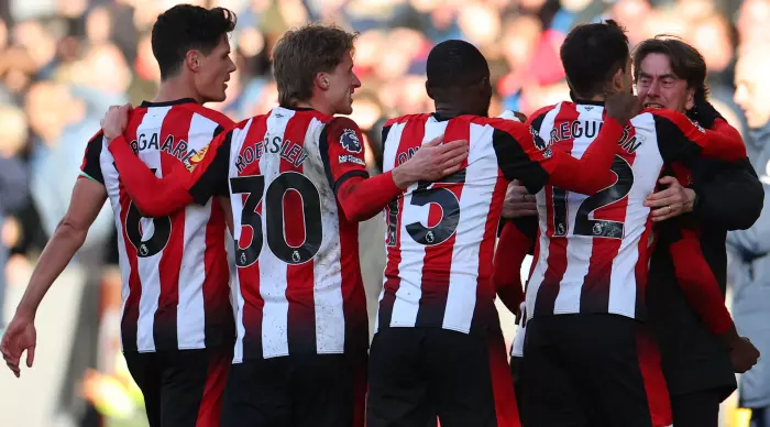 Brentford players celebrate with Thomas Frank (Reuters)
