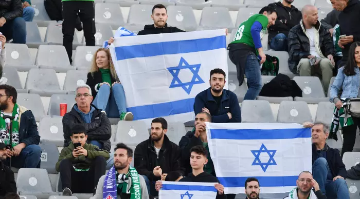 Maccabi Haifa fans with Israeli flags (Reuters)