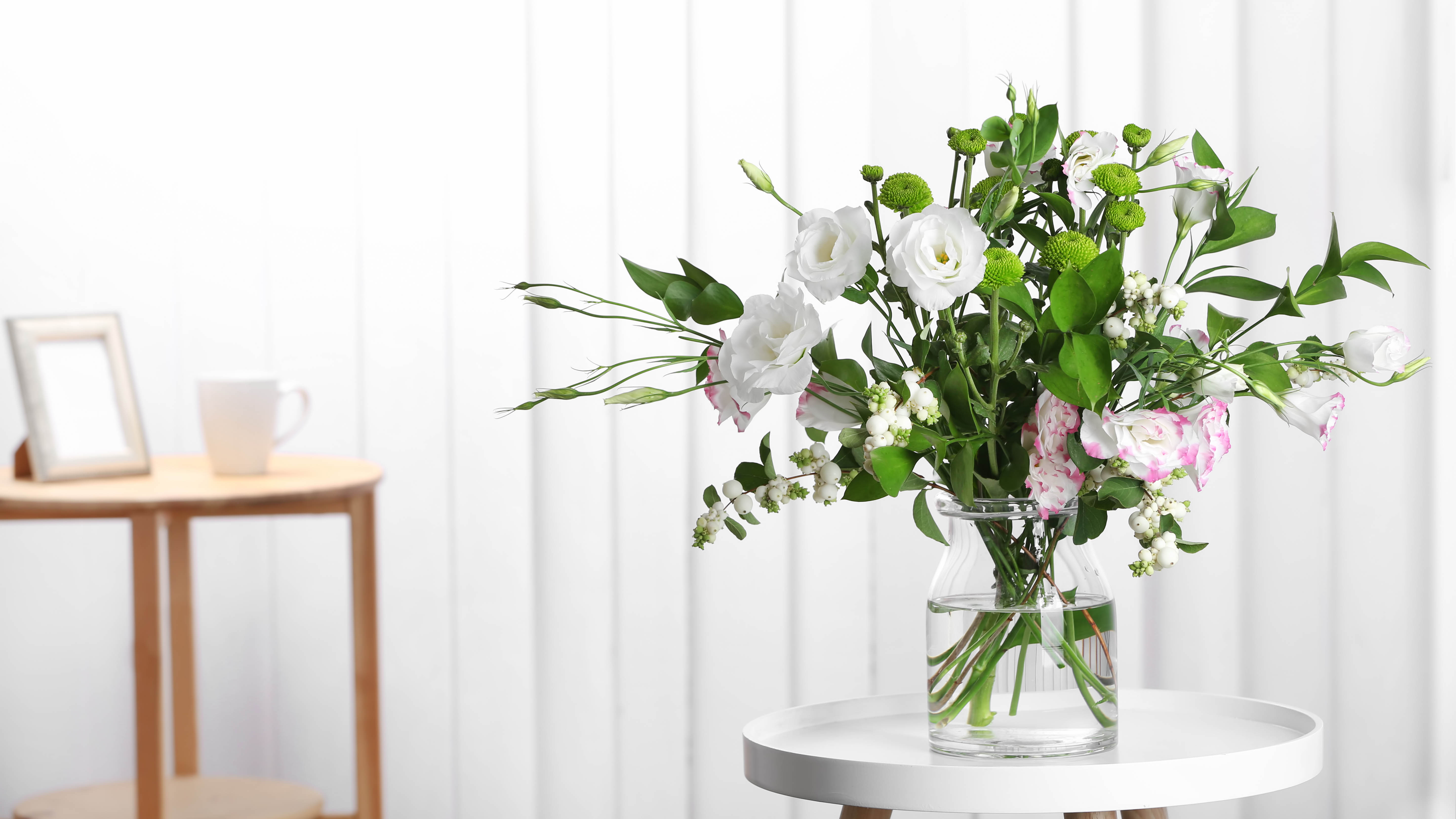 Flowers in a vase on a white table