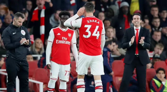 Granit Xhaka taunts the fans against Palace, the only one left from the squad in that game (Reuters)