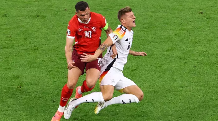 Granit Xhaka in a fight with Toni Kroos, man of the match against Germany (Reuters)