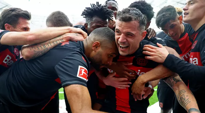 Granit Xhaka celebrates with his teammates at Bayer Leverkusen's championship match (Reuters)