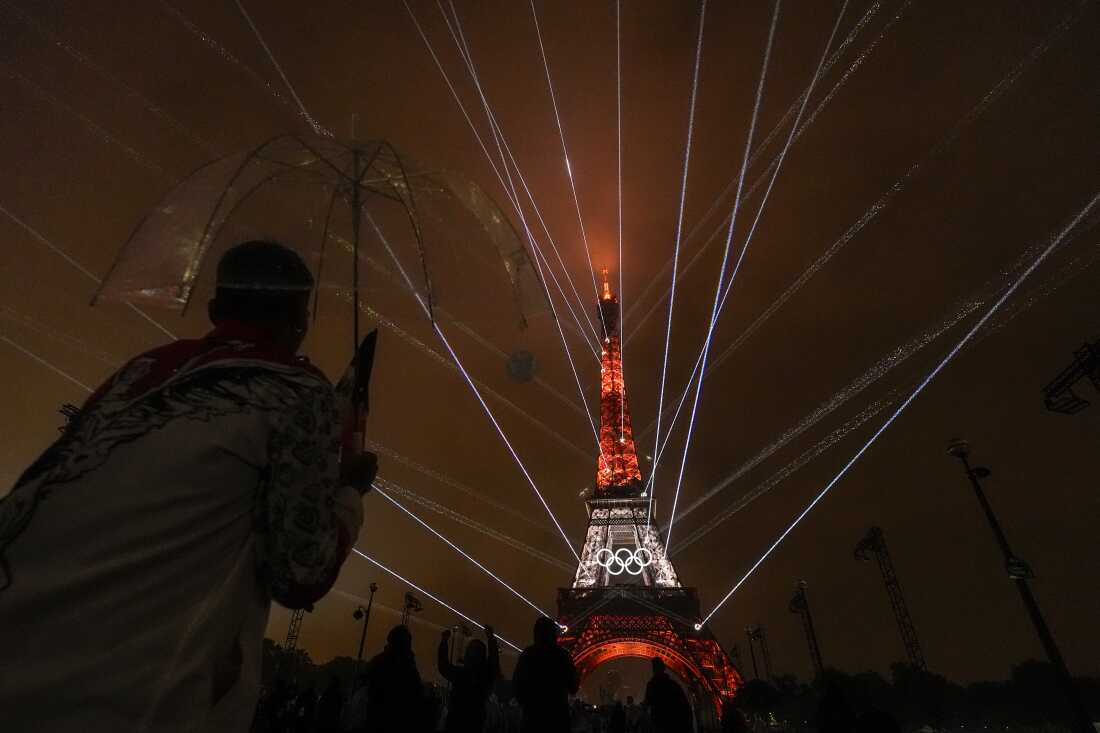 A light show is displayed on the Eiffel Tower during the opening ceremony of the 2024 Summer Olympics, on Friday.