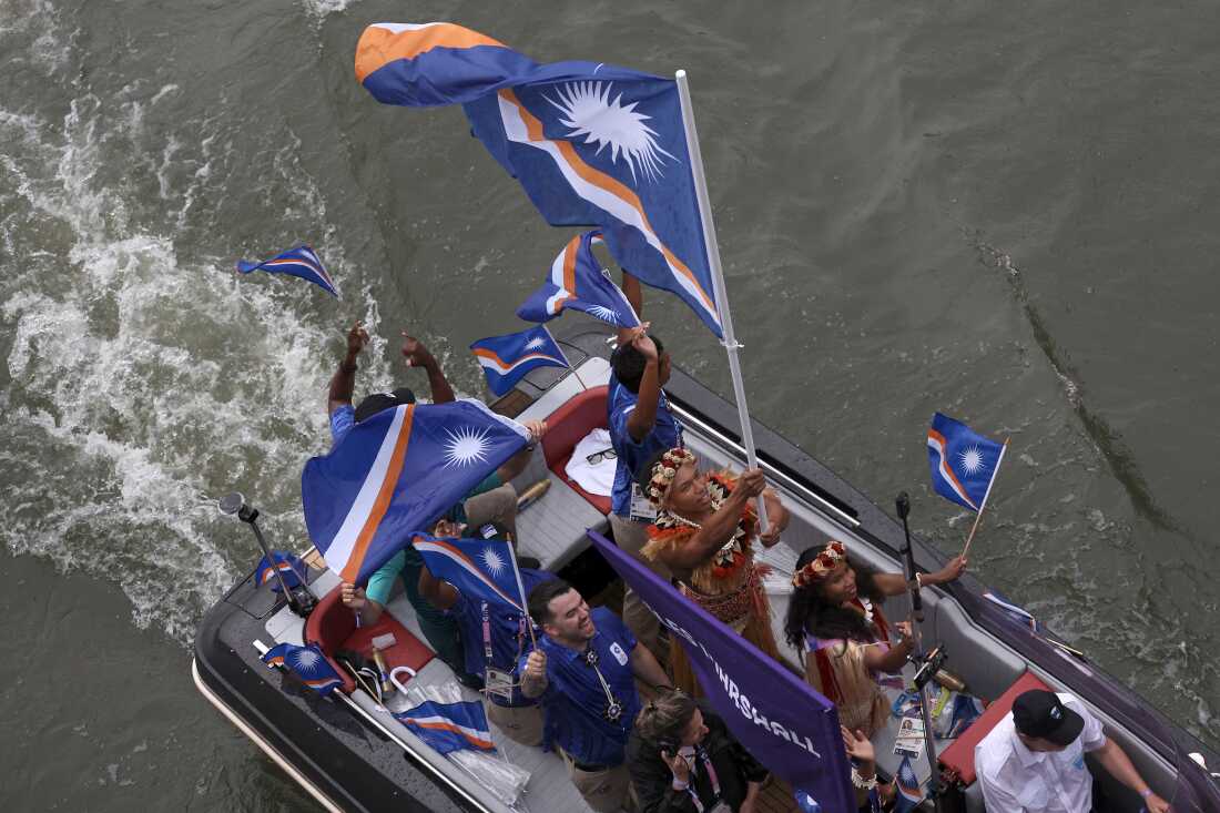 Team Marshall Islands are seen on a boat on the River Seine during the opening ceremony of the Olympic Games Paris 2024 on July 26.