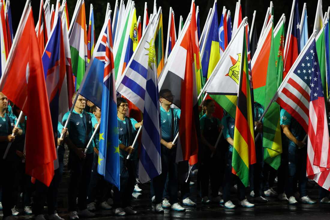 General view as flags of participating countries are carried during the opening ceremony.