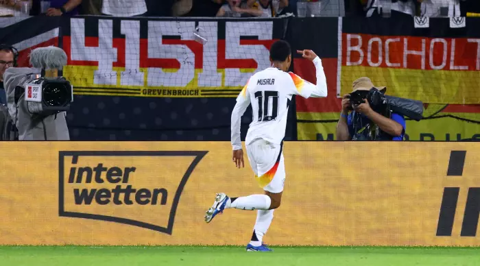 Jamal Musiala celebrates with the players of the German national team (Reuters)