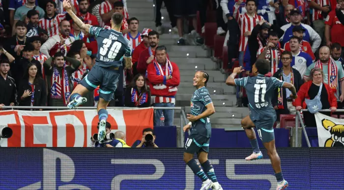 Benjamin Sheshko celebrates with Xavi Simmons and Luis Opanda (Reuters)