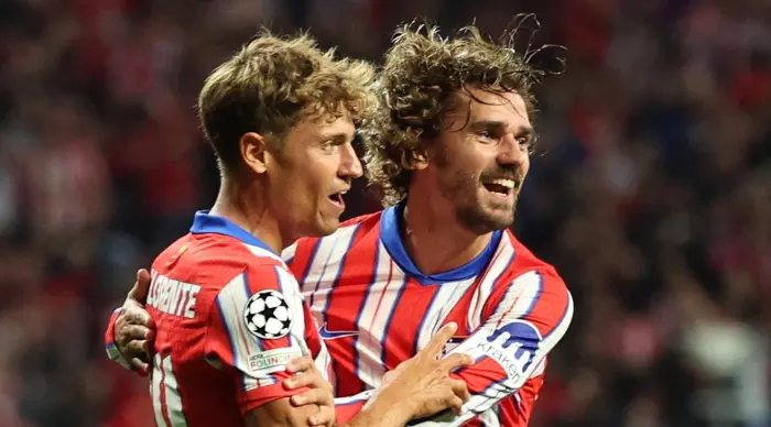 Marcos Llorente celebrates with Antoine Griezmann (Reuters)