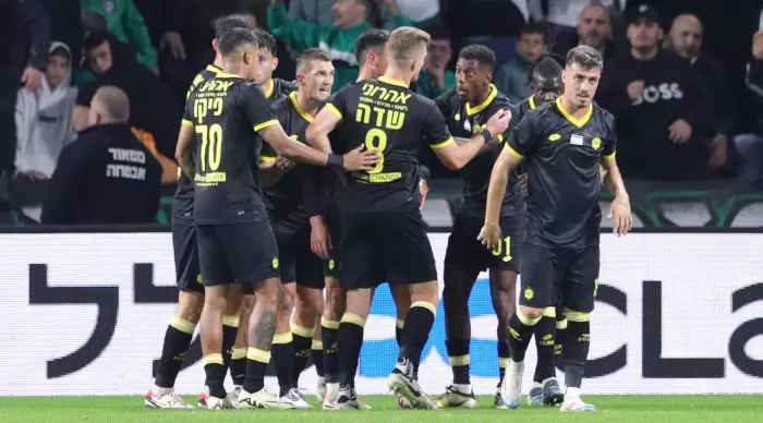 Maccabi Netanya players celebrate with Igor Zlatanovich (Omari Stein)