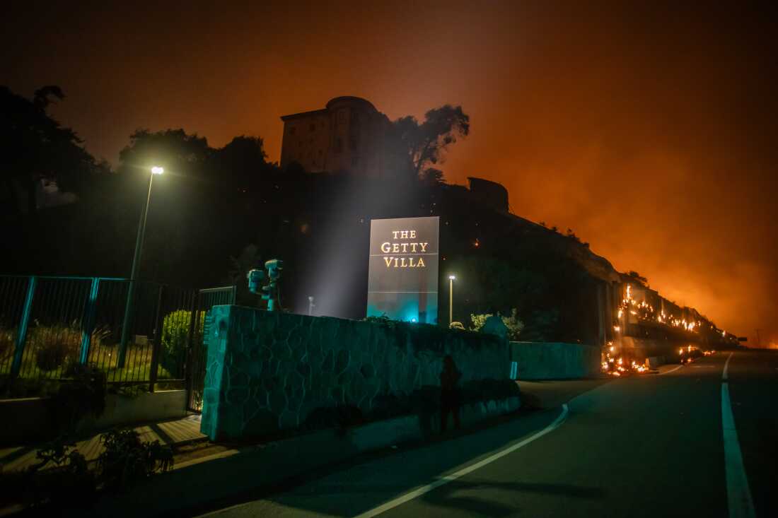 Flames from the Palisades Fire reach the grounds of the Getty Villa Museum on the Pacific Coast Highway amid a powerful windstorm on Jan. 8, 2025 in Los Angeles, Calif.