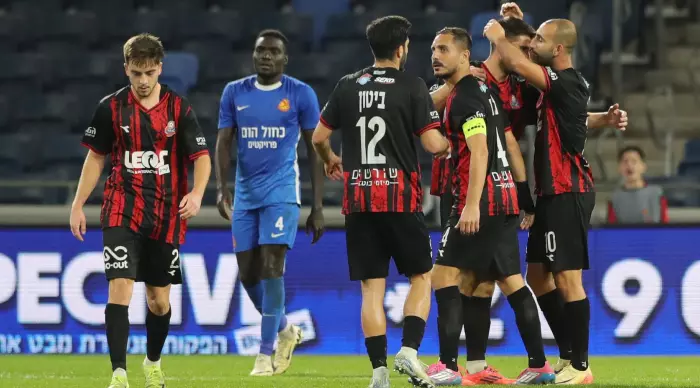 Hapoel Haifa players celebrate with Dor Hogi (Omari Stein)