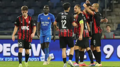 Hapoel Haifa players celebrate with Dor Hogi (Omari Stein)