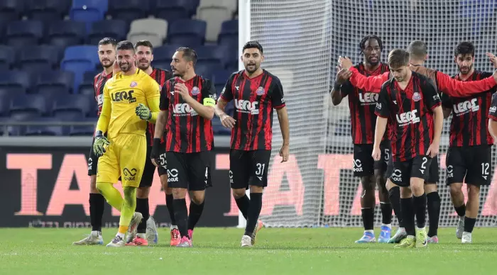 Hapoel Haifa players and Yoav Graffi celebrate at the end (Omari Stein)