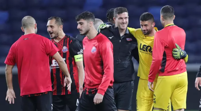 Yoav Grafi and Hapoel Haifa players. His big save (Omari Stein)